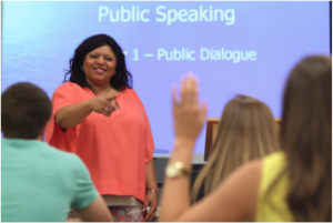 instructor presenting with high contrast slides in classroom